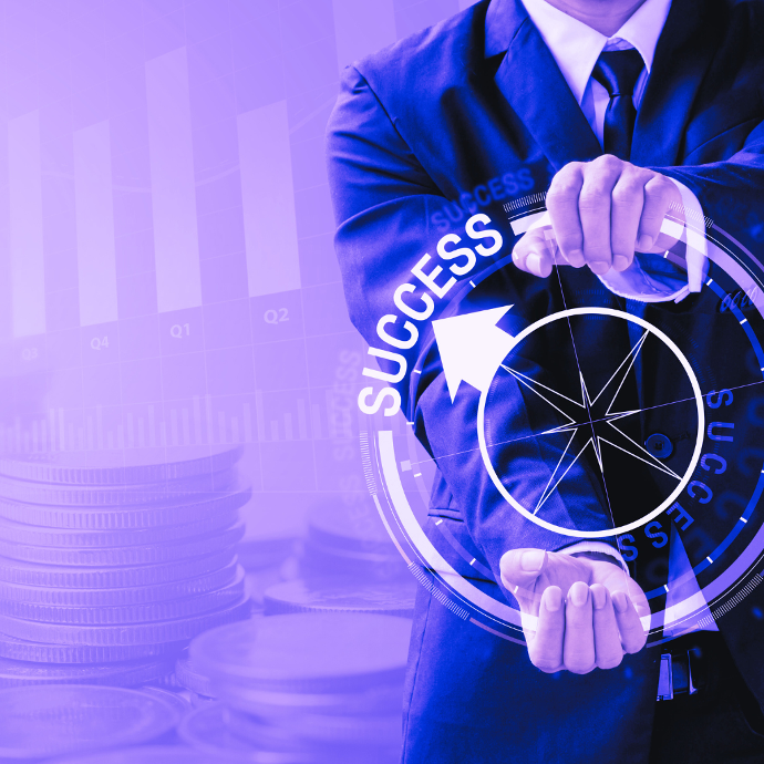 Mission of Success Man holding a compass pointed in the direction of success.